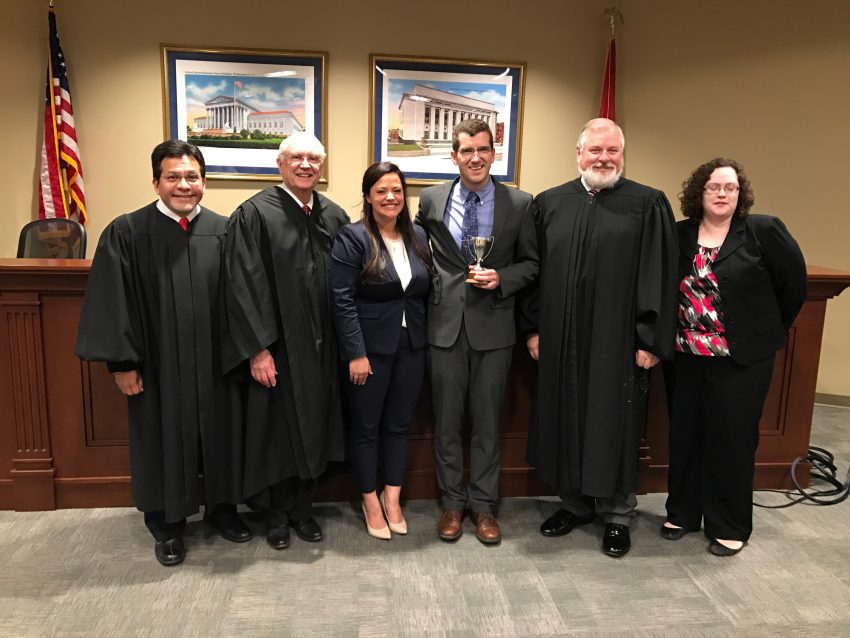 Dean's Cup winner poses with the esteemed judging panel.