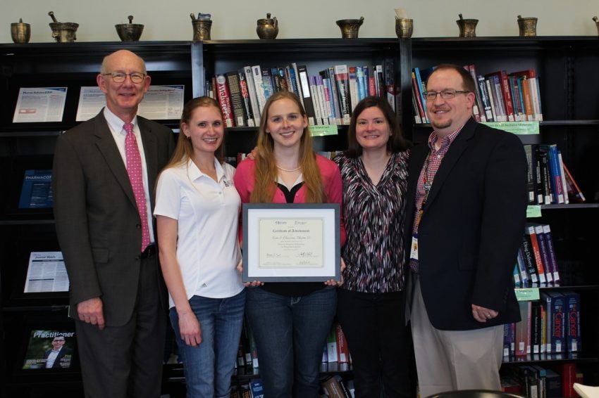 Fellow, Dr. Kate Claussen, poses with members of the Belmont College of Pharmacy
