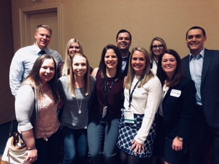 Students who attended the Pharmacy event pose for a photo together.