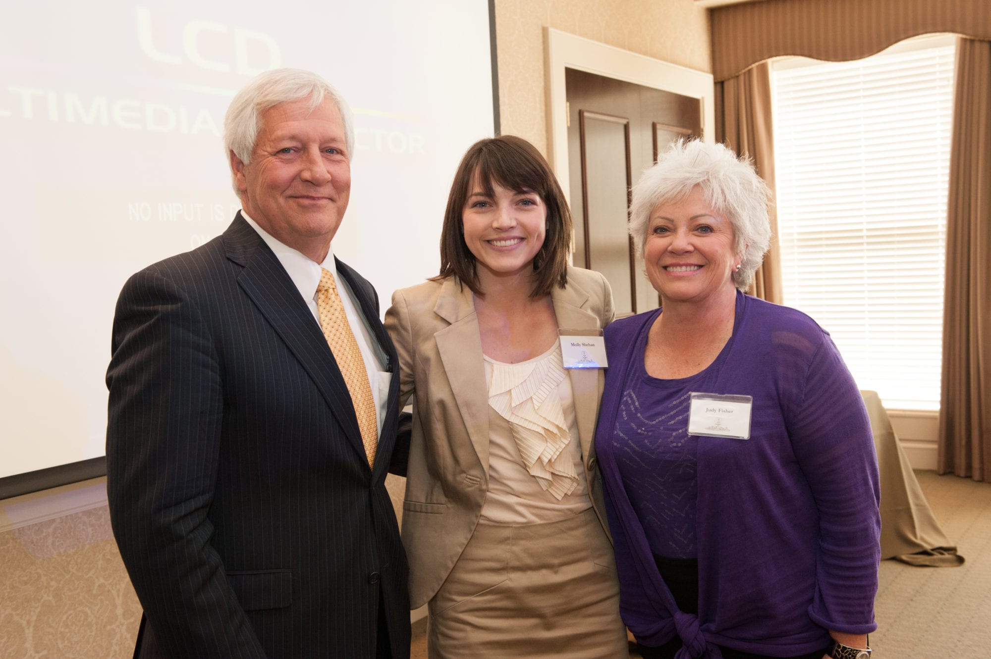Dr. and Mrs. Fisher with a student
