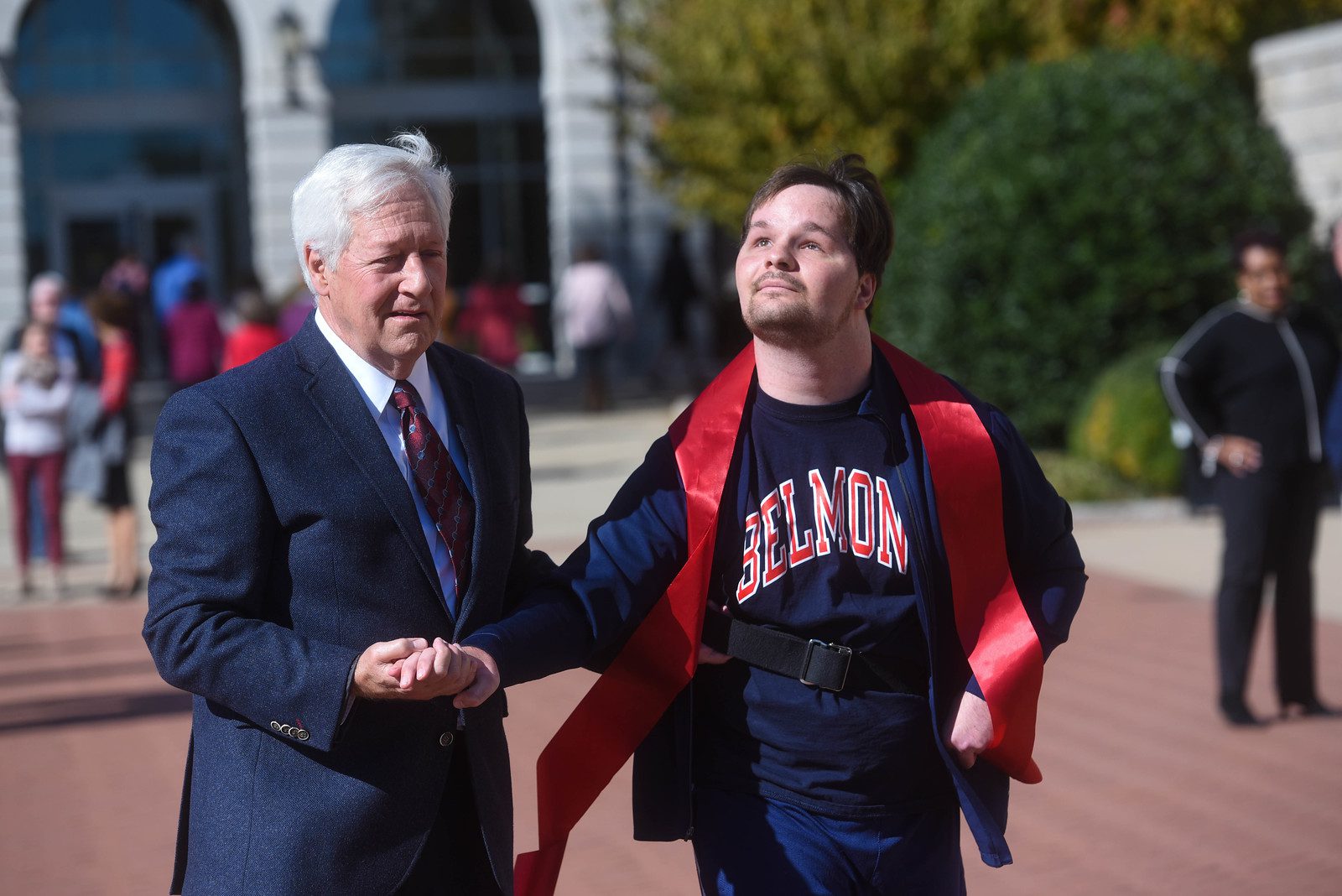 Alumnus Luke Putney Launches Miraculous Walk-a-Thon to Support International Music Education and finishes his marathon with Dr. Fisher