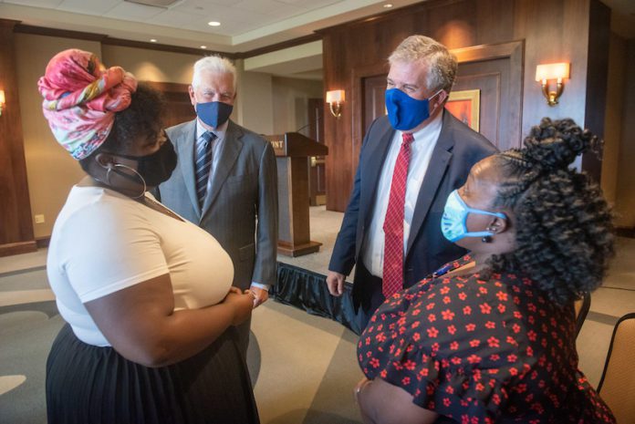 Dr. Greg Jones and Milton Johnson meets current Bridges Scholar Antionedra Maupin's mother after Belmont announced a significant expansion to its Bridges to Belmont partnership with Metro Nashville Public Schools.