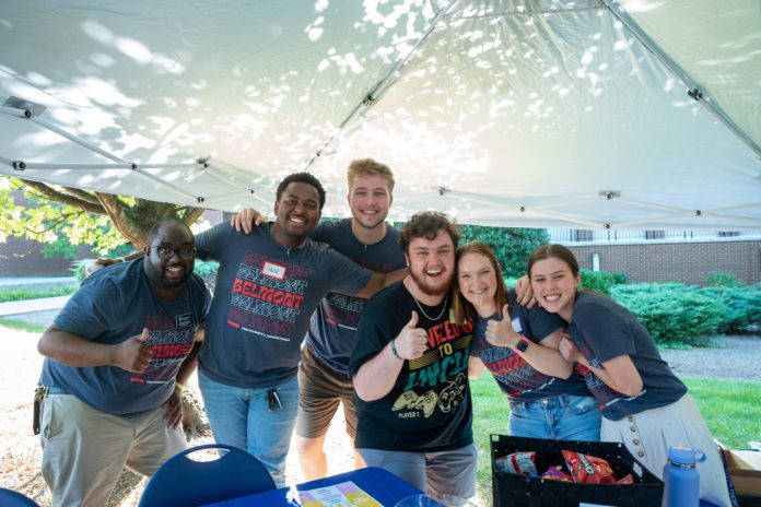 students and staff at fair