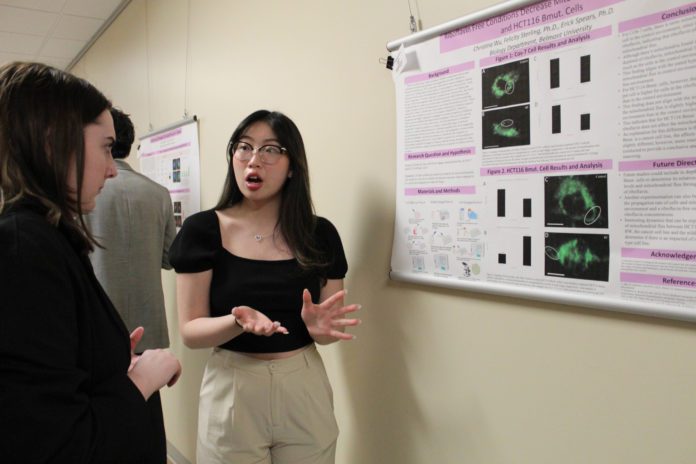 BURS 8 student presenting poster